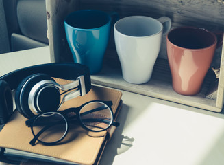 Relax time!! Headset,glasses and diary with Coffee Mug soft focus and selective focus in filter instagram