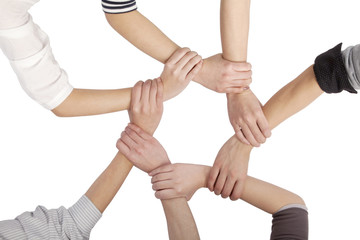 Group of Chinese friends with hands in circle