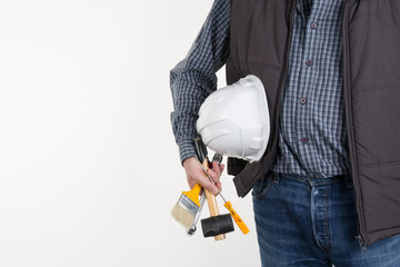 Handsome engineer with helmet isolated on white