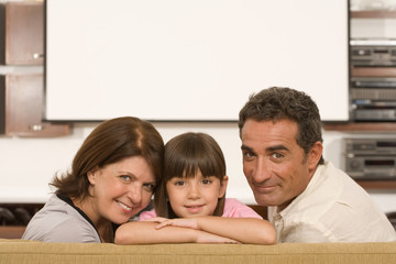 Girl and grandparents in living room