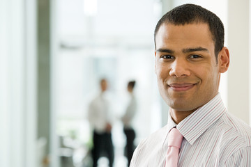 Smiling young male office worker