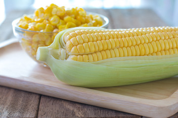 Sweet corn on wooden table