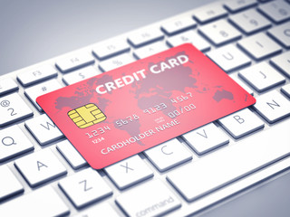 Credit card on a computer keyboard , Safe banking and online shopping