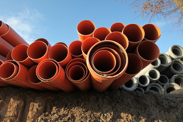 red plastic water pipes construction site