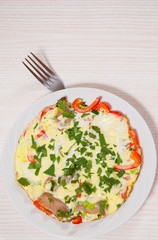 omelet with bacon, vegetables and cheese