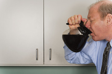 Businessman drinking out of coffee pot - Powered by Adobe