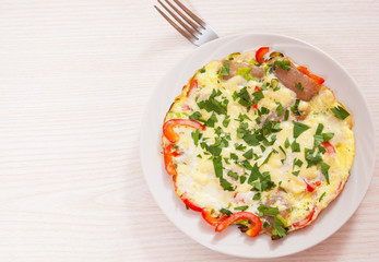 omelet with bacon, vegetables and cheese