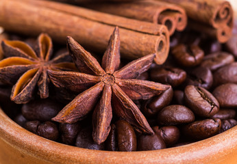of coffee with coffee beans and cinnamon sticks