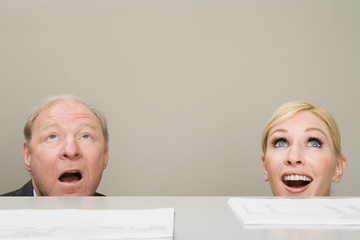 Office workers looking up in surprise
