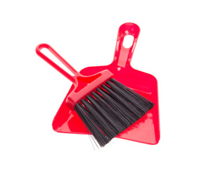 Red brush and plastic dustpan.