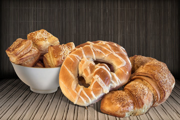 Pretzels with Bunch of Croissant Sesame Puff Pastry on Bamboo Place Mat Background.