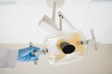 Dentist with lamp