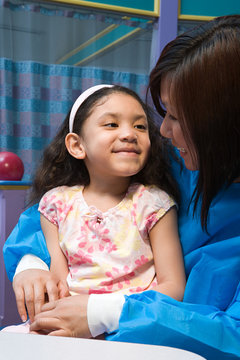 Smiling girl and nurse