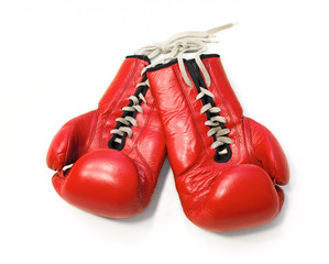 Red boxing gloves on white background