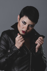 serious gesture girl dressed in black leather jacket