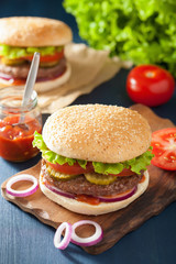 burger with beef patty lettuce onion tomato ketchup