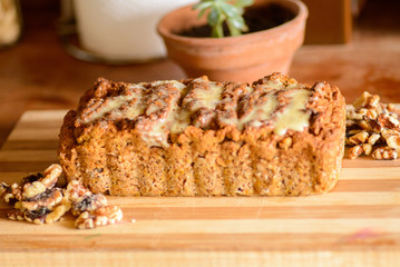Carrot and orange vegan cake with nuts and vegan condensed milk