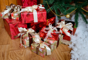 Christmas gifts under a fir-tree