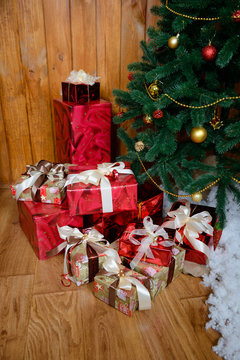 Christmas gifts under a fir-tree