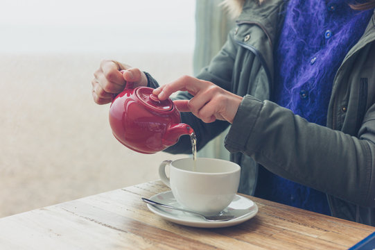 Woman drinking tea in cafe