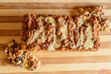Carrot and orange vegan cake with nuts and vegan condensed milk