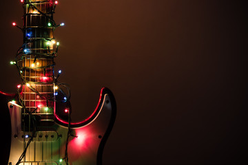 electric guitar wrapped by garland