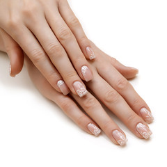 Beautiful female hands with french manicure isolated