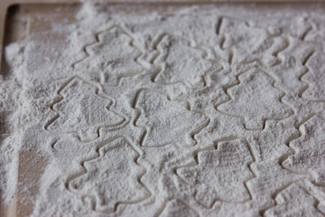 form for christmas cookies on flour