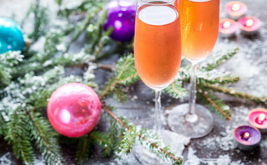 Fototapeta na wymiar Two glasses of champagne with Christmas tree branch
