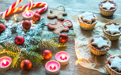 Decorated Christmas tree branch with holiday pastry