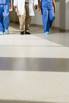 Doctors walking down corridor