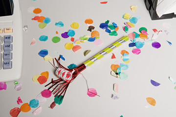 Party horn blower on office desk