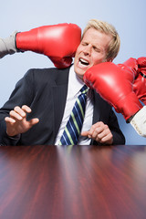 Businessman getting punched
