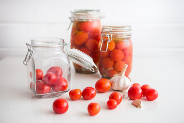 pots of marinated tomatoes