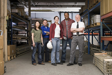 Workers in warehouse - Powered by Adobe