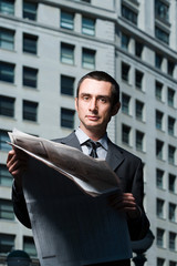 Businessman with newspaper