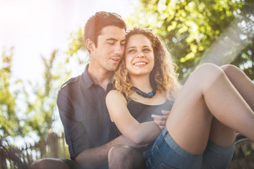 Fototapeta premium Couple relaxing after a ride in the park with bicycles. Healthy
