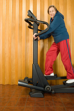 Senior Woman Walking On A Treadmill