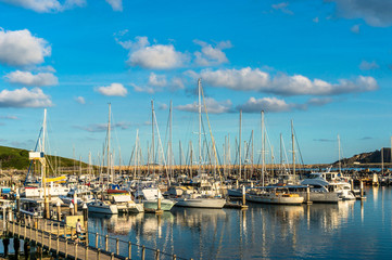 Fototapeta na wymiar Coffs Harbour bay with yachts, boats on sunny day