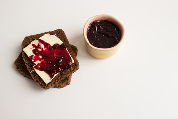 Breakfast: brown bread with butter and currant jam
