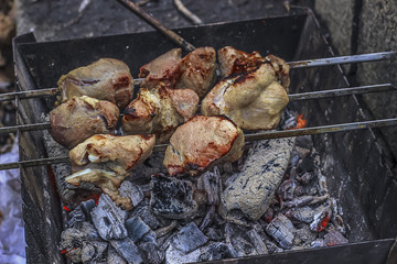 pieces of meat on the grill