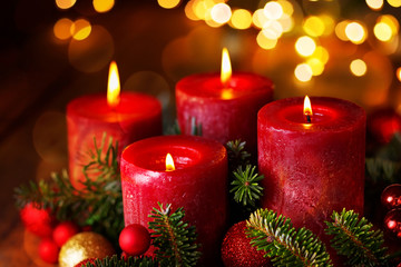 Four burning candles in festive christmas arrangement, 4. Advent