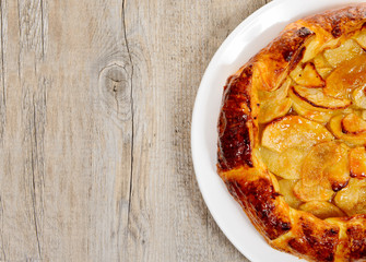 apple pie cut in half in plate