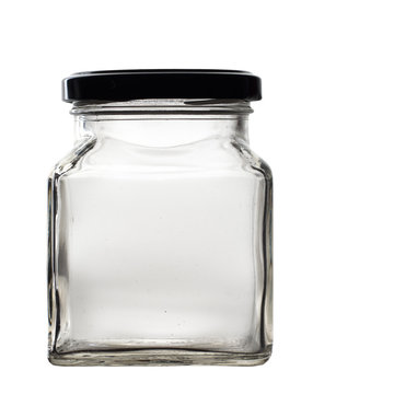 Old Glass Jar With Lid Isolated On Black. Empty.