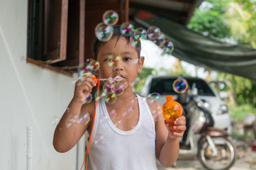 Children playing with soap bubbles, Boy with Bubbles
