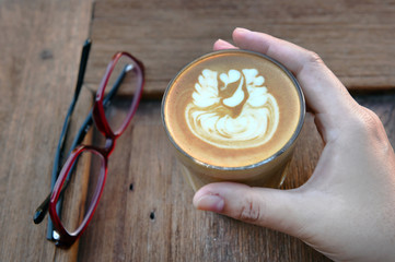 a cup of latte art coffee.