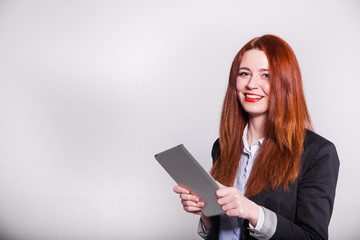 red businesswoman showing tablet isolated over white