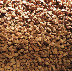 Macro of instant coffee grains in the jar