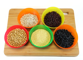 various beans and rice in colorful bowls