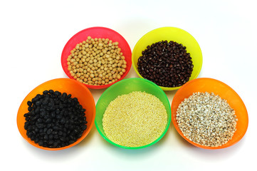 various beans and rice in colorful bowls